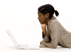Young African American woman looking at her laptop